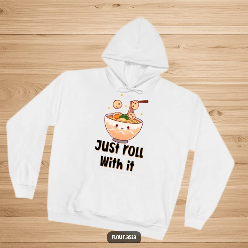 Funny kawaii ramen bowl character steaming and juggling tiny fish cakes on a cozy hoodie, a perfect funny gift.