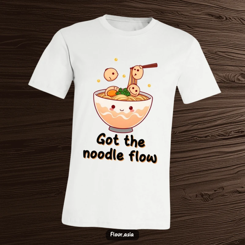 Funny kawaii ramen bowl character steaming and juggling tiny fish cakes on a t-shirt, a perfect funny foodie gift.