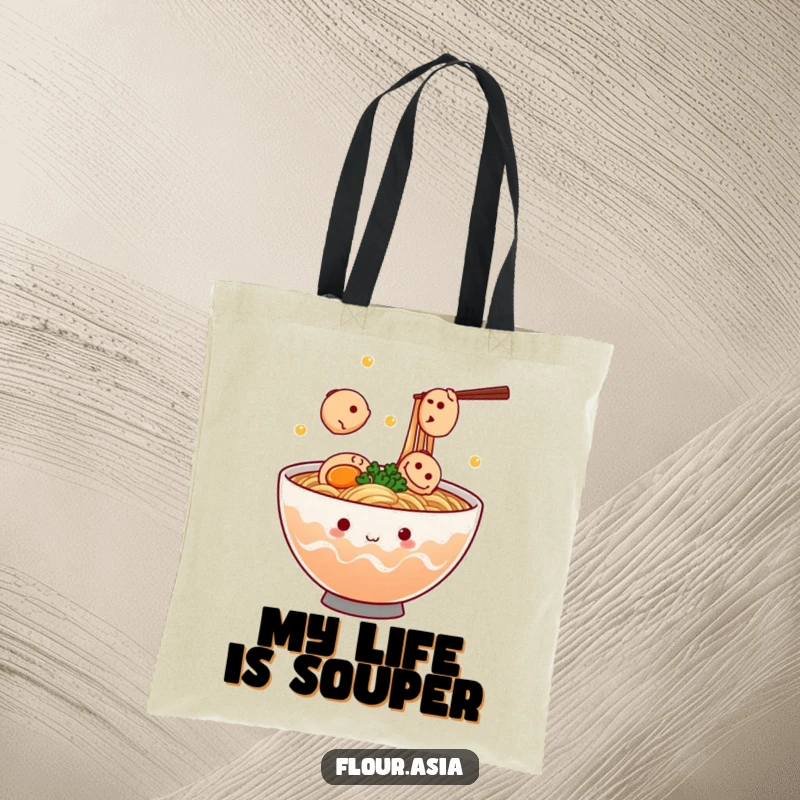 Funny kawaii ramen bowl character steaming and juggling tiny fish cakes on a tote bag, ideal funny gift for foodies.